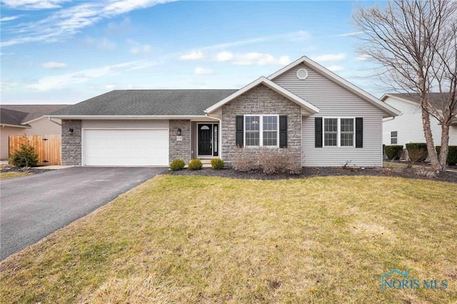 ranch-style home with aphalt driveway, a garage, fence, stone siding, and a front yard