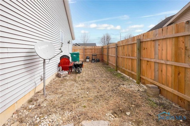 view of yard with a fenced backyard