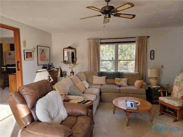 living room featuring a ceiling fan