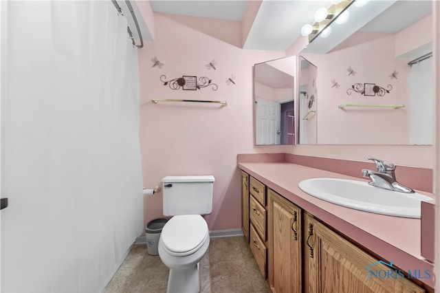 full bathroom with toilet, vanity, a shower with curtain, baseboards, and tile patterned floors