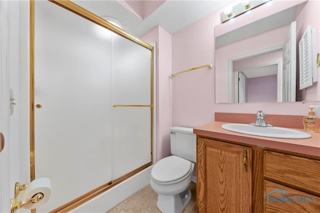 full bath with toilet, a stall shower, and vanity