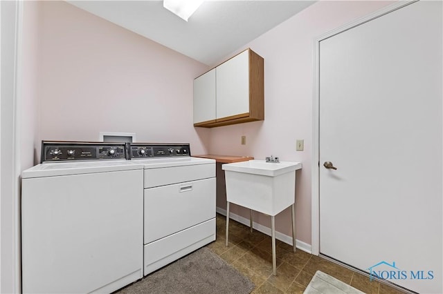 laundry area featuring washer and dryer and cabinet space