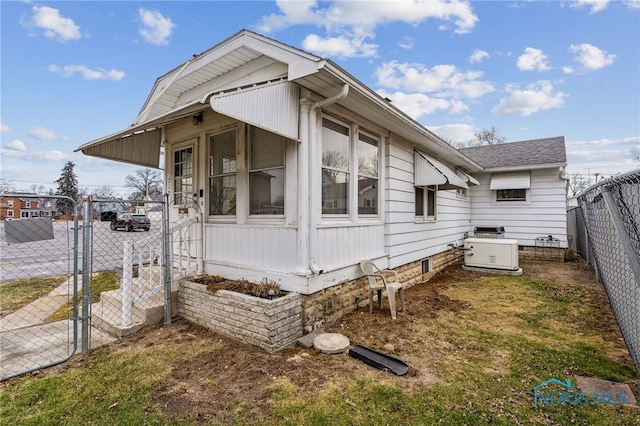 view of side of property with a gate and fence