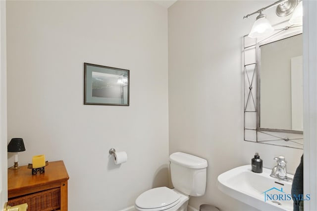 bathroom featuring a sink and toilet