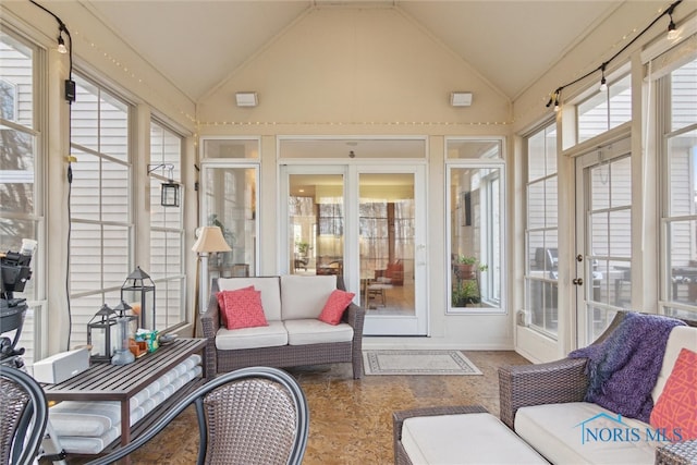 sunroom / solarium featuring lofted ceiling