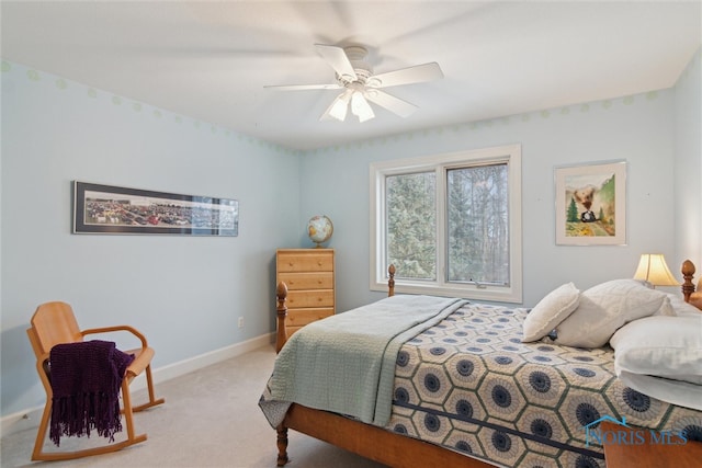 bedroom with baseboards, a ceiling fan, and light colored carpet