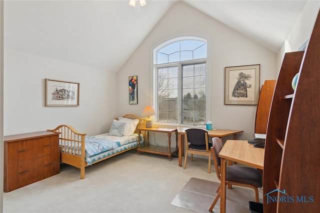 bedroom featuring light carpet and vaulted ceiling