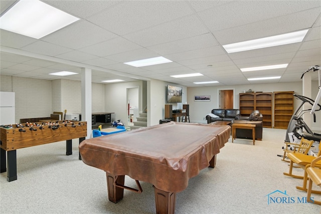 recreation room with carpet and a drop ceiling