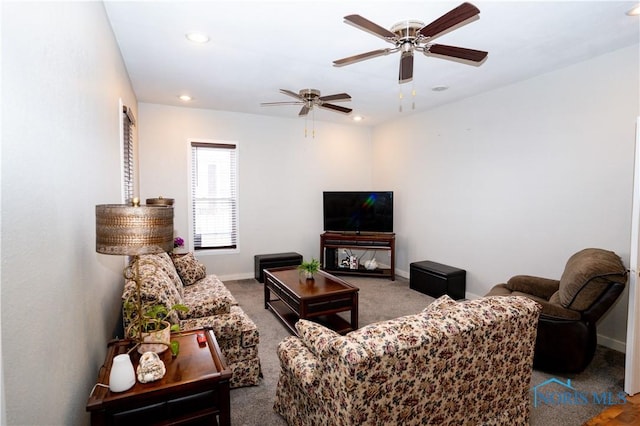 living room featuring carpet, baseboards, a ceiling fan, and recessed lighting