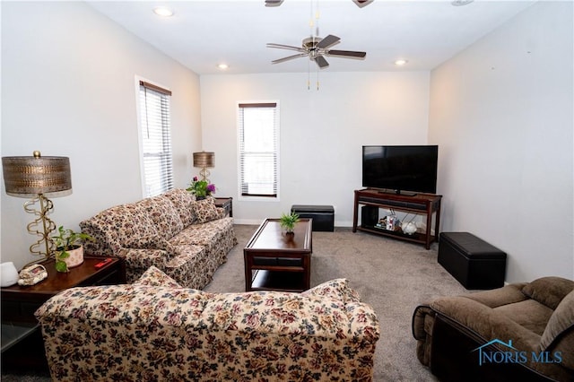 carpeted living room with baseboards, a ceiling fan, and recessed lighting