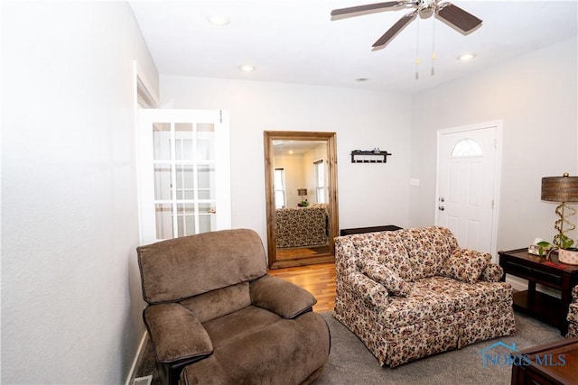 sitting room featuring a ceiling fan, wood finished floors, and recessed lighting