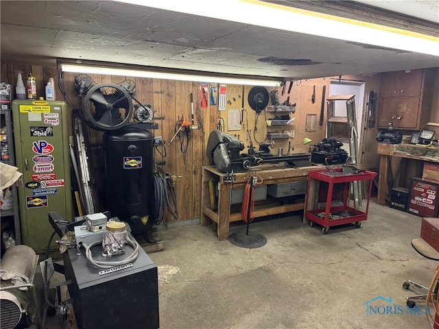 interior space featuring a workshop area and wooden walls