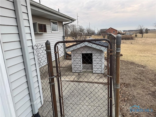 view of gate featuring fence