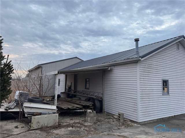 exterior space featuring metal roof