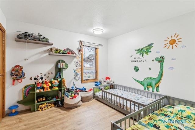 bedroom featuring wood finished floors