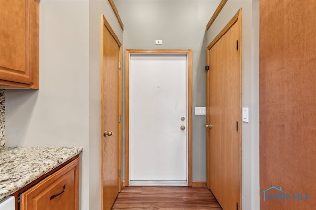 hallway with wood finished floors