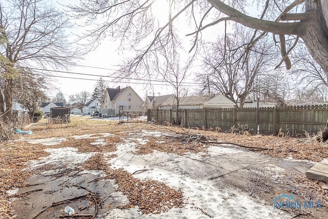 view of yard with a residential view and fence