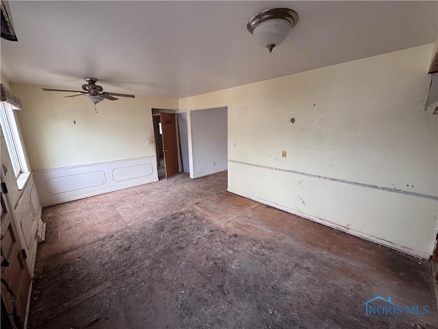 unfurnished room with a ceiling fan