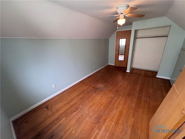 bonus room with ceiling fan, baseboards, vaulted ceiling, and wood finished floors