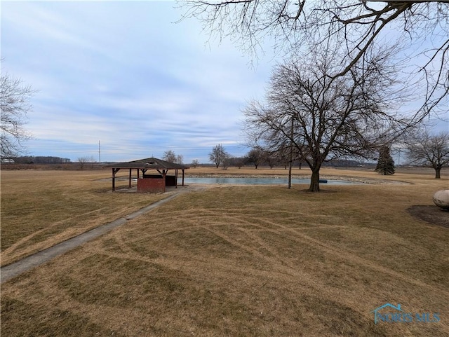 view of yard with a water view and a gazebo