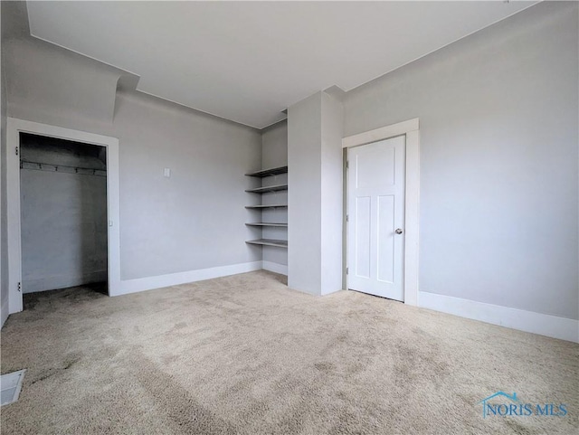 unfurnished bedroom with carpet and baseboards