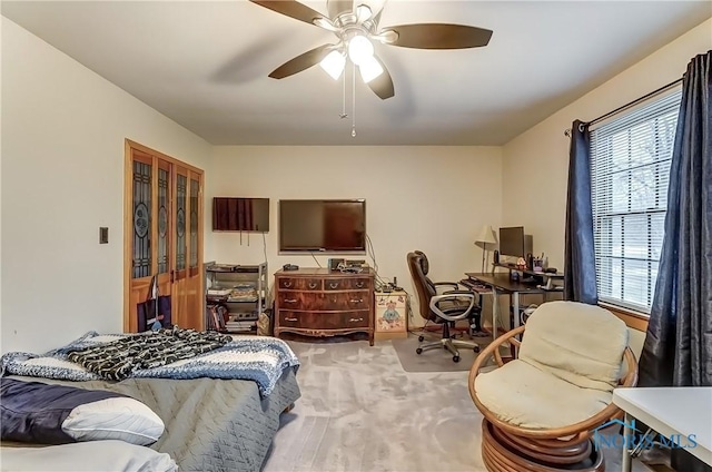 carpeted bedroom featuring ceiling fan