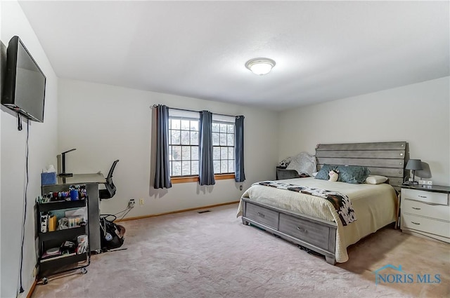 bedroom with carpet flooring, visible vents, and baseboards