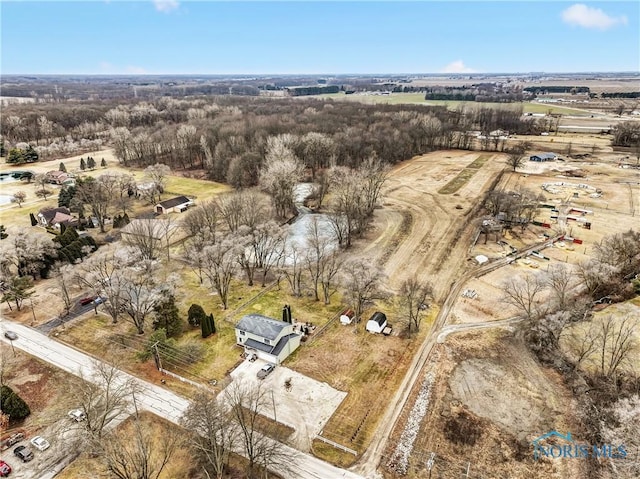 birds eye view of property with a rural view