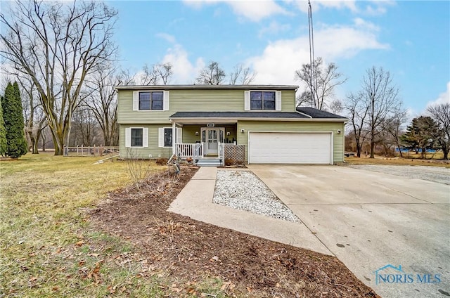 traditional-style house with covered porch, concrete driveway, an attached garage, and a front yard