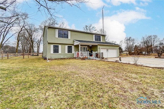 view of front of home with driveway, a porch, a front yard, and fence