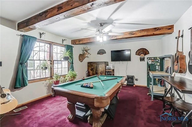 game room featuring carpet flooring, beamed ceiling, visible vents, and baseboards