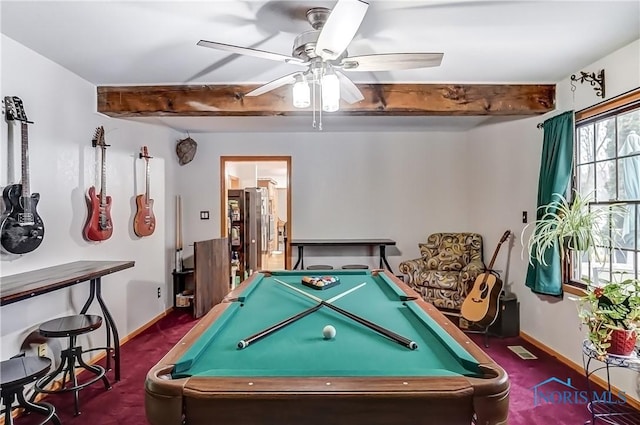 playroom with a ceiling fan, carpet, beam ceiling, and baseboards