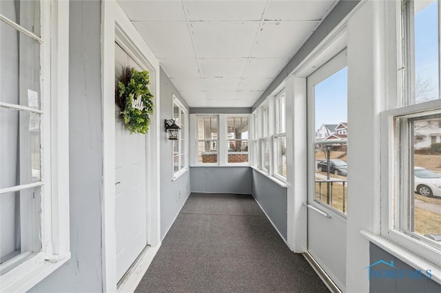 unfurnished sunroom featuring a healthy amount of sunlight