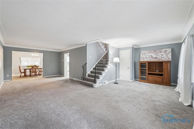 unfurnished living room with ornamental molding, stairway, and carpet flooring