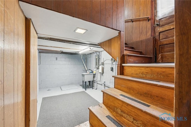 interior space with concrete block wall and concrete floors