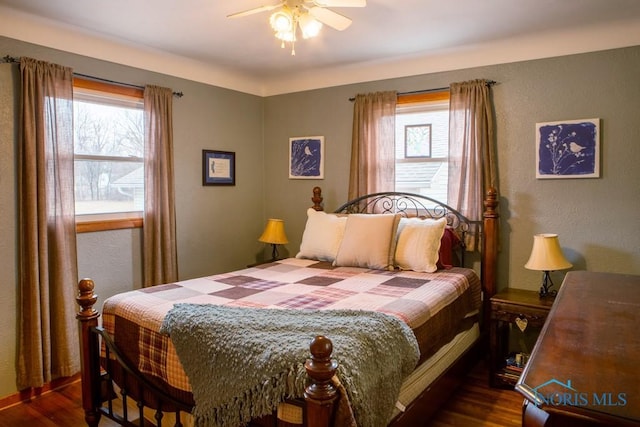 bedroom featuring ceiling fan and wood finished floors