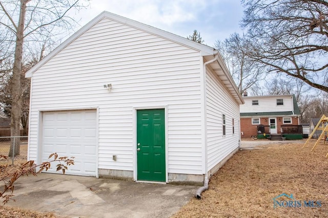 garage with fence