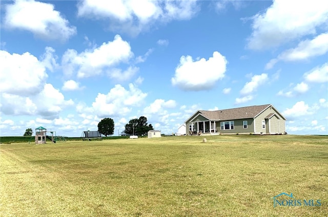 exterior space with an outbuilding and a storage unit