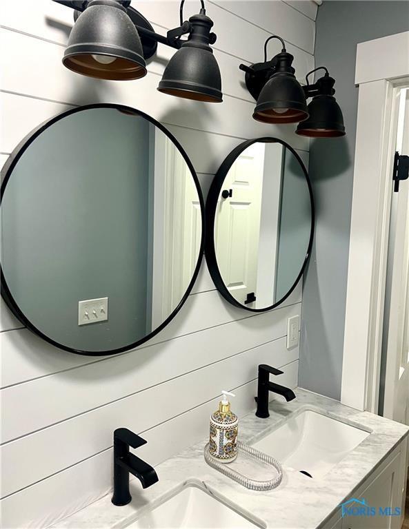 interior details with a sink and double vanity