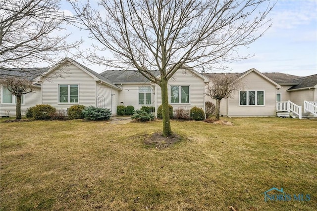 ranch-style house with a front lawn