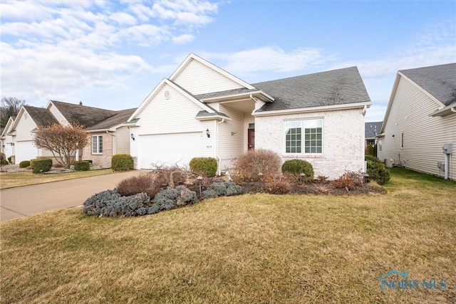 view of front of property with central air condition unit, a front yard, concrete driveway, and brick siding