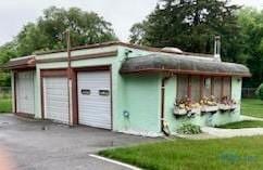 garage featuring driveway