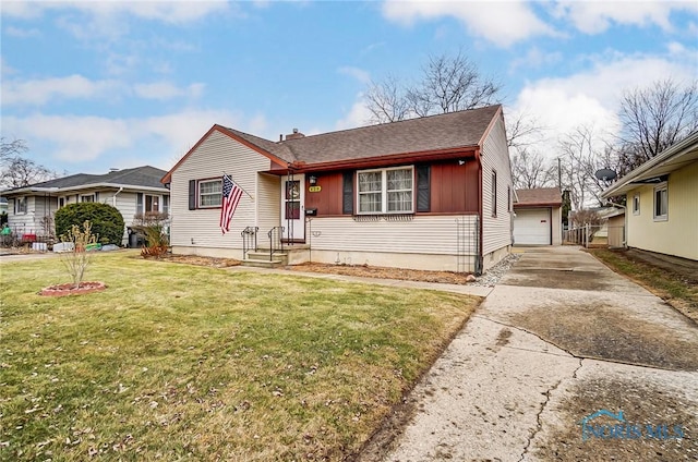 view of front of home featuring board and batten siding, an outbuilding, and a front yard