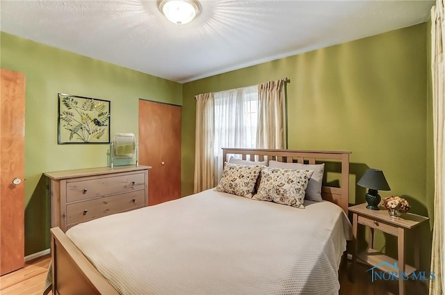 bedroom featuring light wood-type flooring