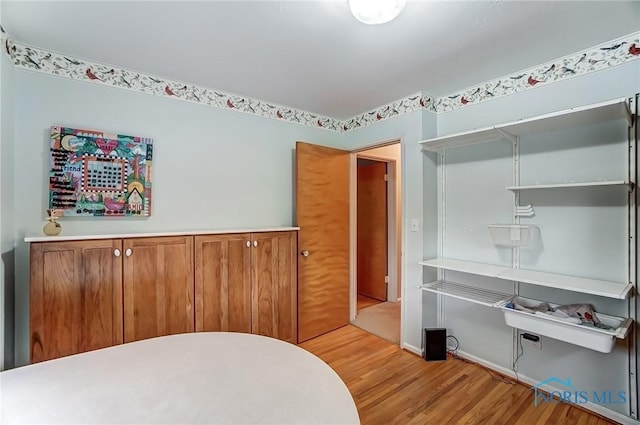 bedroom featuring light wood-style floors