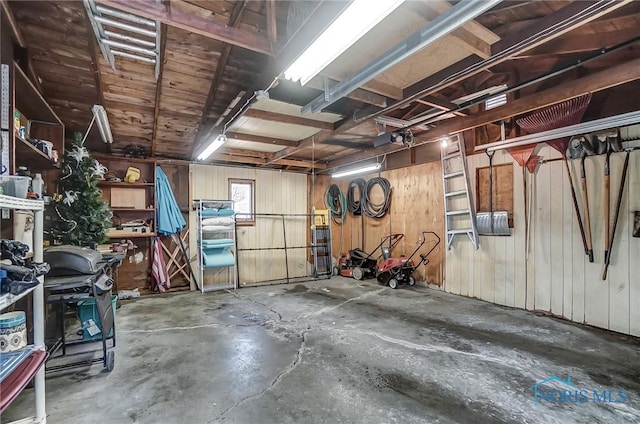 interior space featuring wood walls