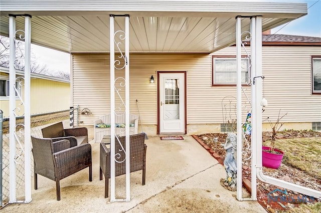 entrance to property with a patio area and outdoor lounge area