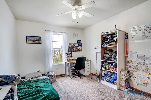 bedroom featuring carpet floors, a ceiling fan, and baseboards