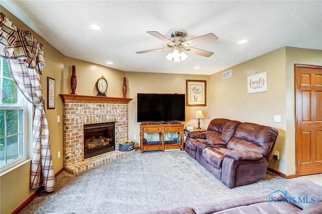 carpeted living area featuring a fireplace, recessed lighting, visible vents, a ceiling fan, and baseboards