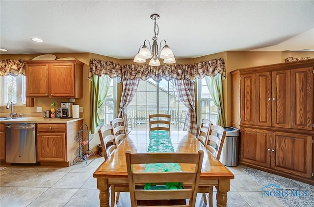 dining space featuring recessed lighting, a healthy amount of sunlight, an inviting chandelier, and light tile patterned floors